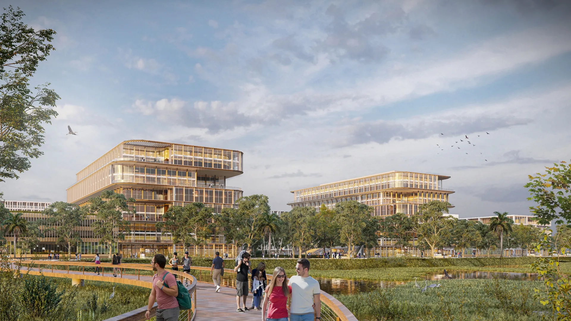 Vista de un proyecto residencial en Kendall Reserve, con edificios modernos rodeados de naturaleza y personas