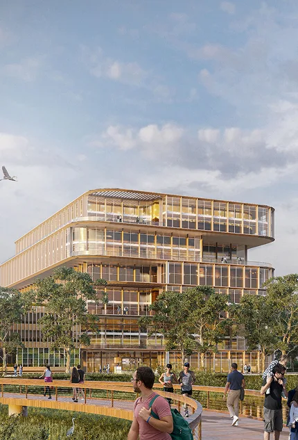 Edificio moderno en Kendall Reserve, rodeado de naturaleza y personas disfrutando del espacio comunitario.